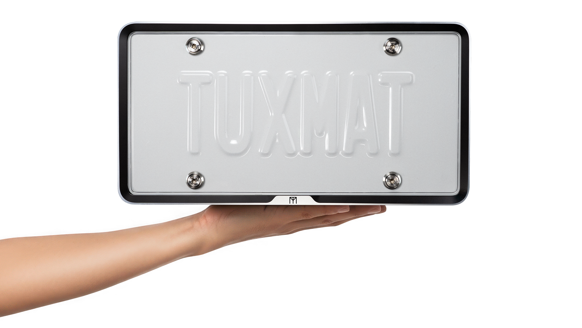 TuxMat Capsule license plate case held in hand